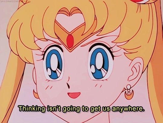 Sailor Moon with a small smile but otherwise kind of blank expression in full headshot looking slightly to viewer's left, saying "Thinking isn't going to get us anywhere."