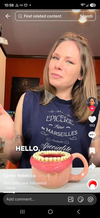 A screenshot of a TikTok, the creator has made a ceramic mug with realist teeth an lips around the brim. This should lead the viewer to wonder, "Oh no, whyyyy???"